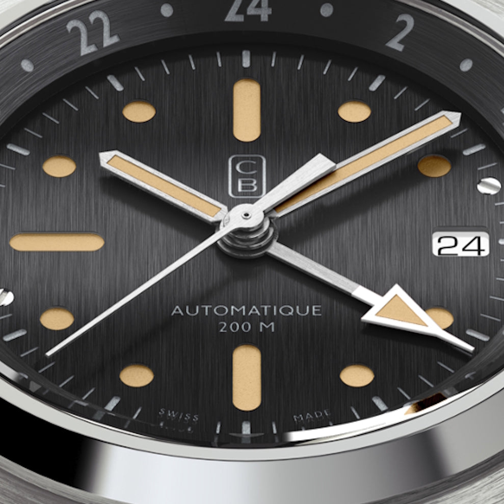 Close up on the dial of the Swiss Made CB01 GMT 90 made of recycled stainless steel