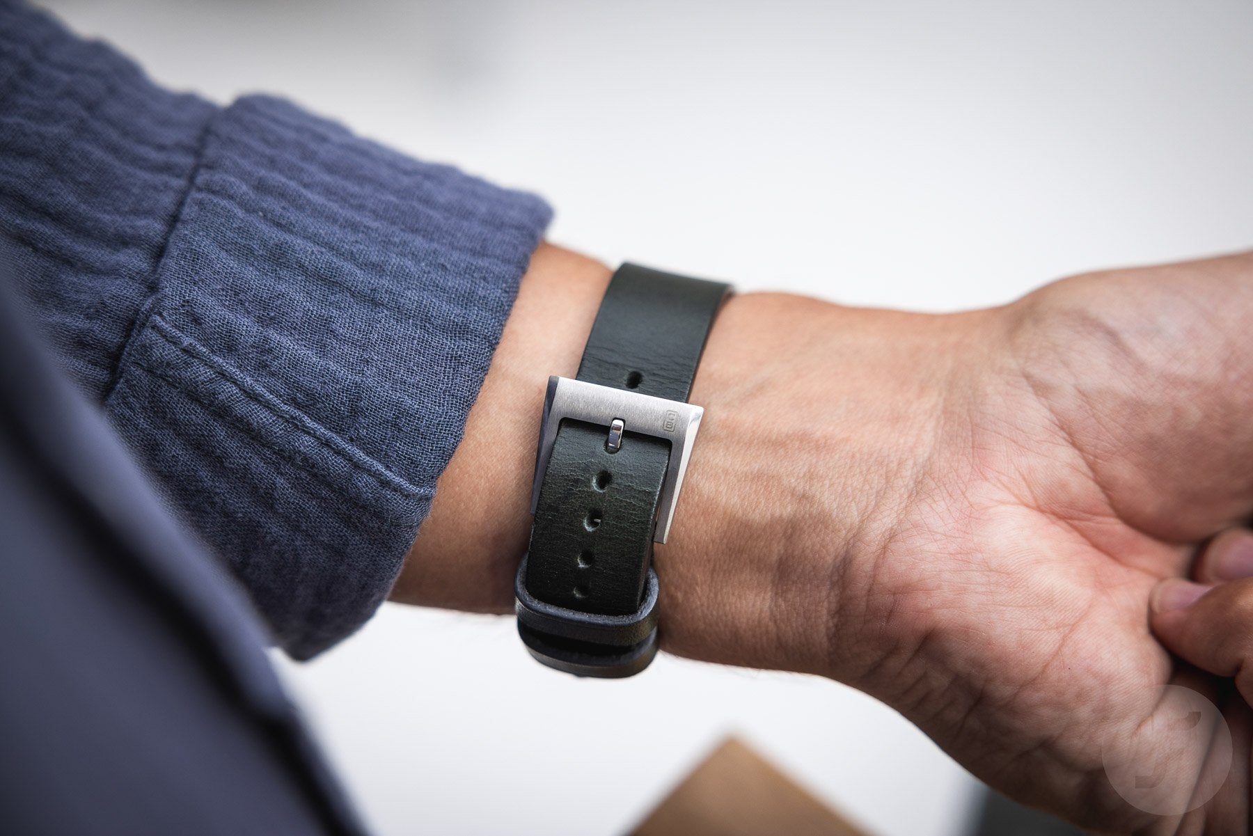 Sustainable handmade leather strap made in Switzerland. Buckle made of repurposed stainless steel