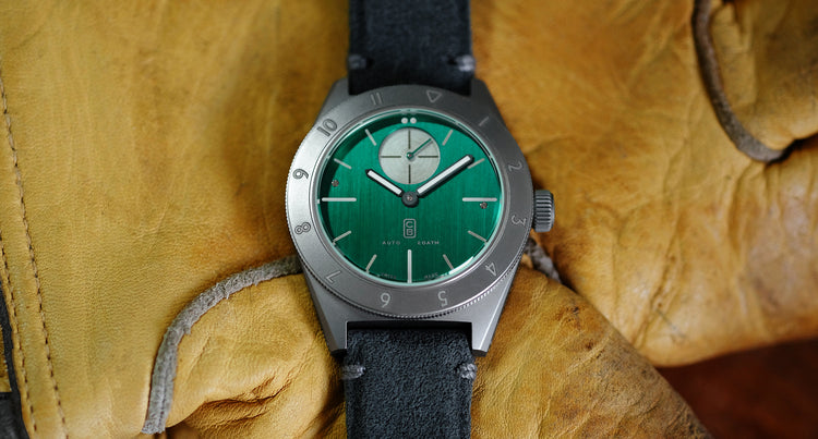 Cedric Bellon Watch with green dial made of repurposed titanium on yellow loves