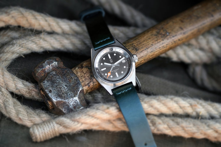 Tool watch CB01-GT on a vintage hammer in a craftmanship context