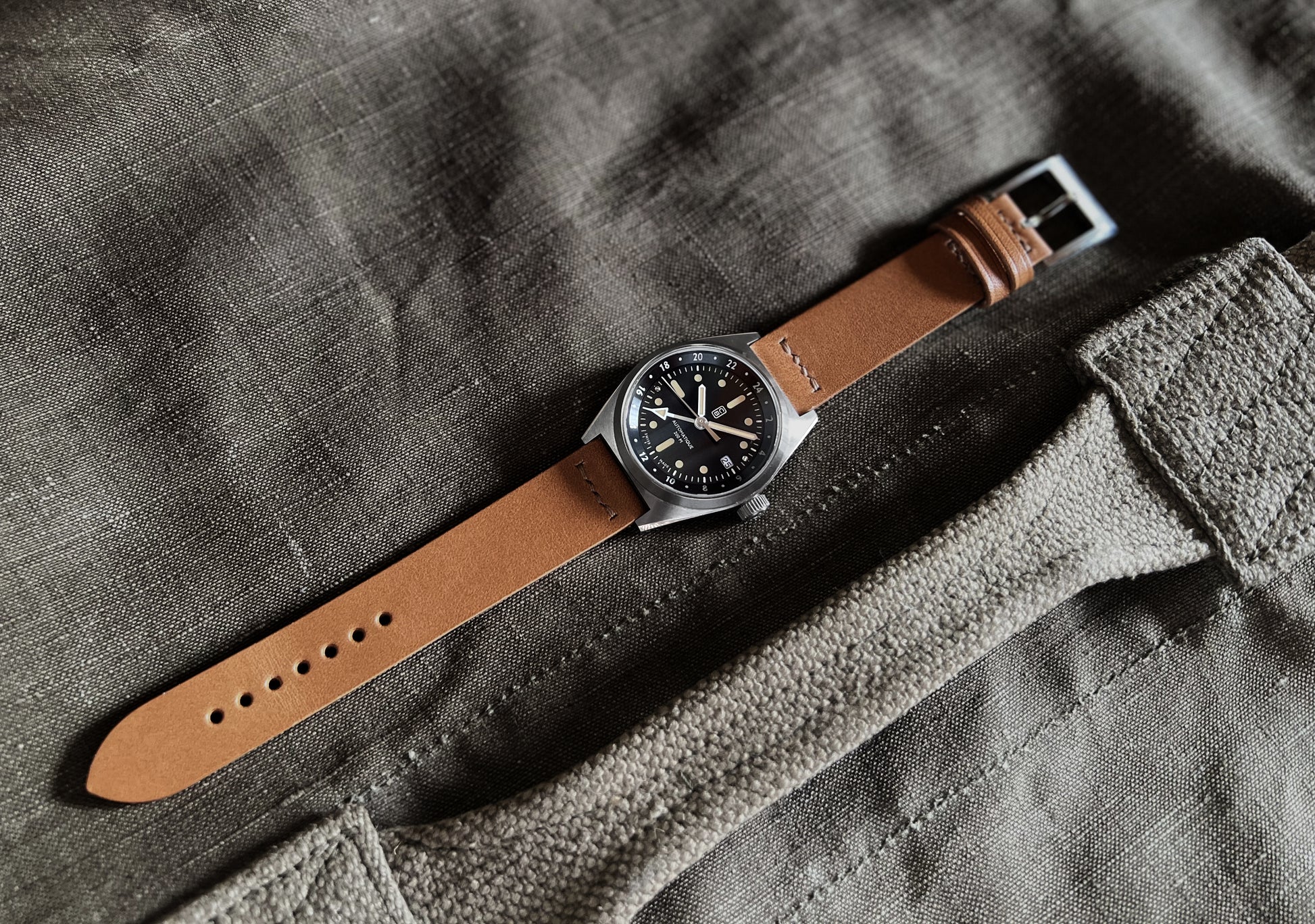 Natural textures, sustainable and ecological Cedric Bellon watch placed on ecofriendly fabric