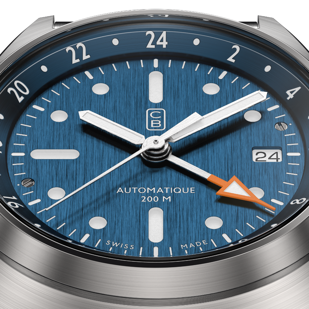 CB01 GMT men watch blue dial closeup. Tool watch made of recycled stainless steel. White superluminova. Swiss made