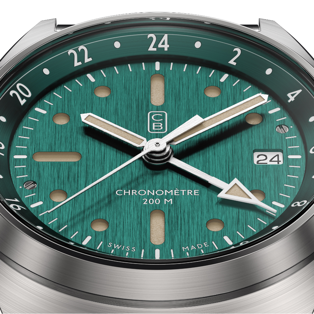 GMT watch green dial closeup. Tool watch made of recycled stainless steel. Old radium superluminova. Swiss made