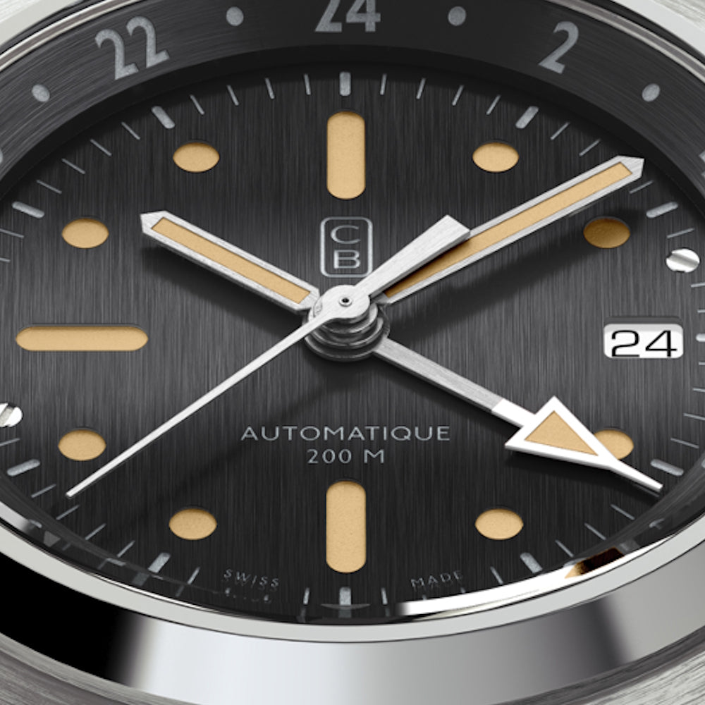CB01 GMT watch black dial closeup. Tool watch made of recycled stainless steel. Old radium superluminova. Swiss made